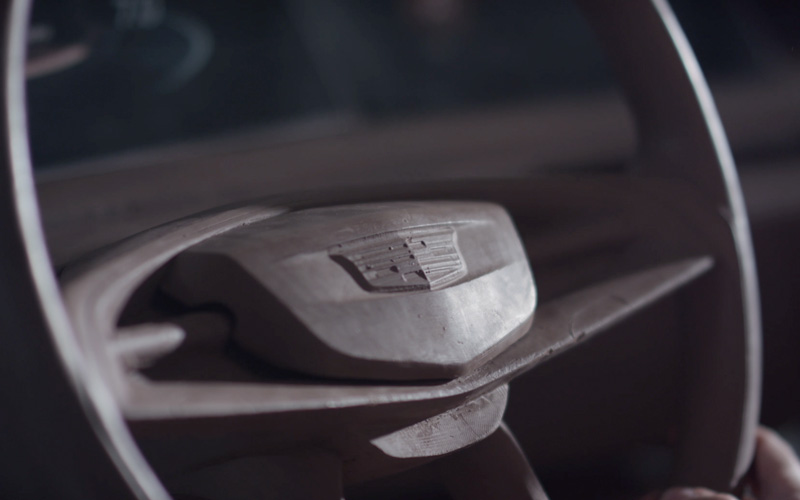 The steering wheel of a Cadillac car sculpted from clay